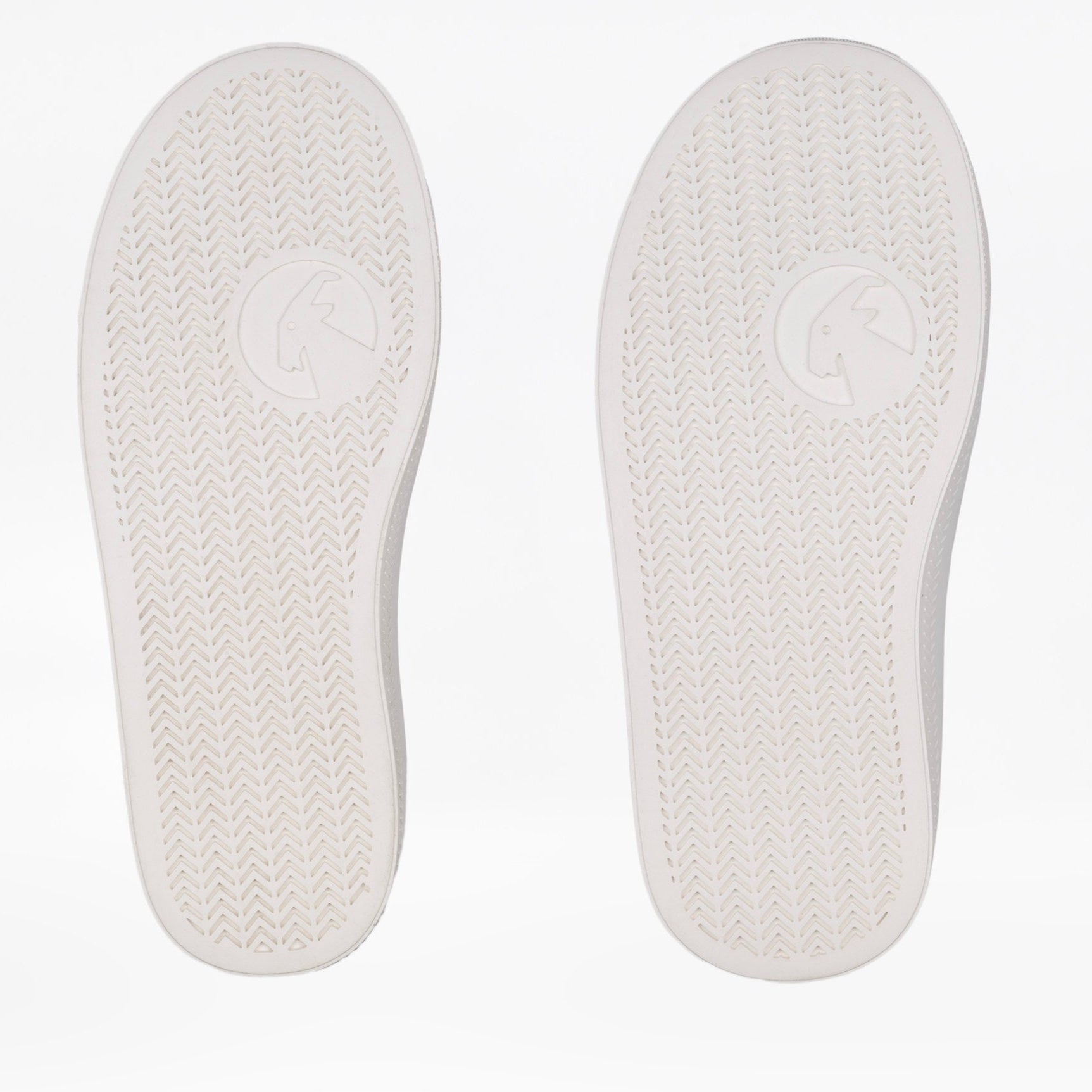Two white shoe insoles shown side by side on a light background showing width differences. Both insoles have a textured tread pattern and a circular goat-head logo near the center.