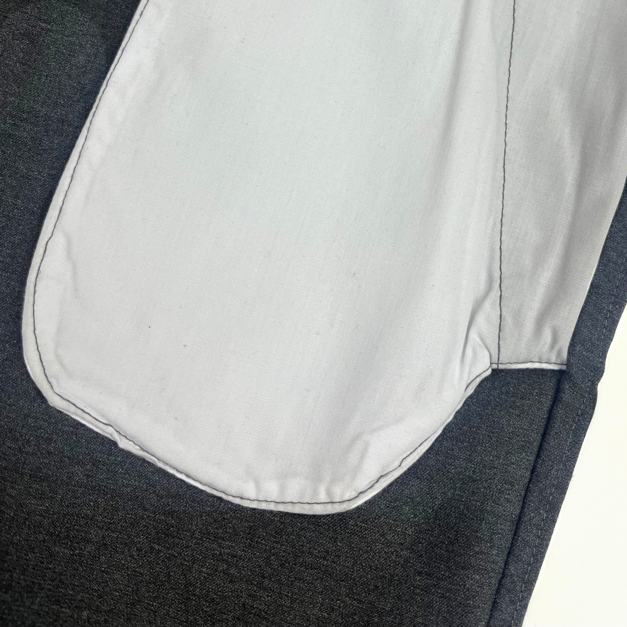 Close up of inner pocket detail, showing the tidy seams, no loose threads.