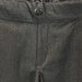 Close-up of charcoal school trouser waistband with non-functional button detail